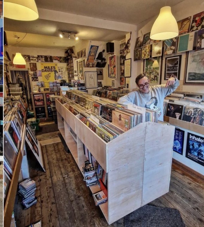 Steve Bull inside Polar Bear Records, looking down a row of vinyl racks, posters lining the walls