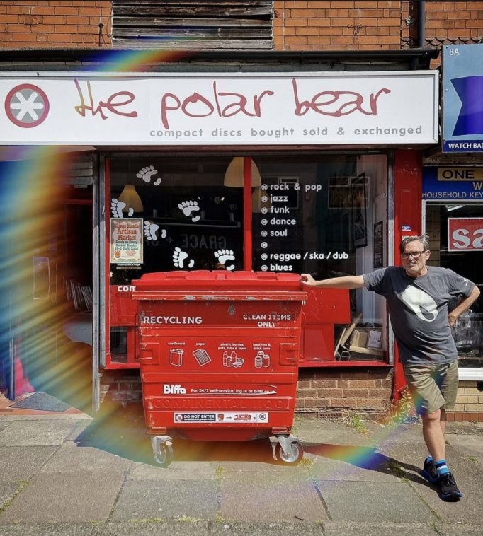 The polar bear shopfront at 10 York Road, Kings Heath, Birmingham. Painted white facade with red polar-bear silhouette, Steve Bull standing outside.